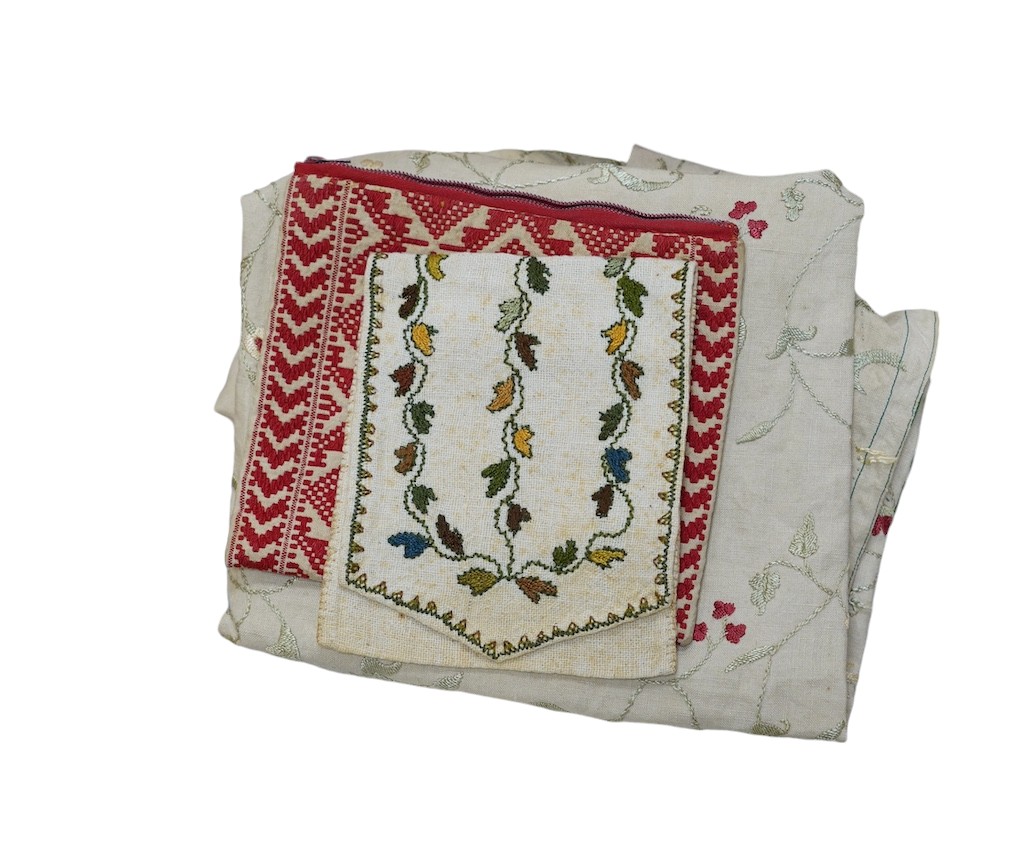 A 19th century embroidery on linen, a decorative hand towel in blue cross stitch, a finely worked table centre and a collection of handkerchiefs, etc. Condition - fair